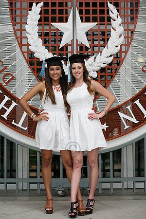 Two Girls posed with UT emblem