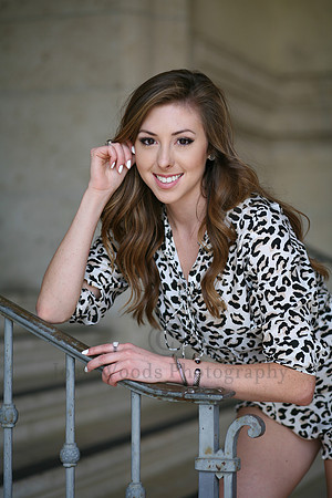 Senior girl posed on step railing