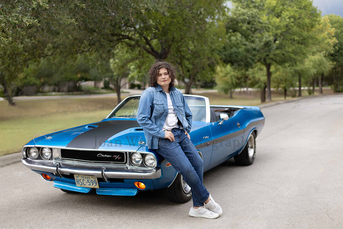 senior guy portrait featuring a vintage sports car and editorial posing for high school seniors.