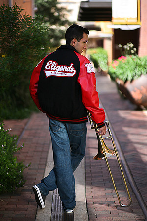 San Antonio Churchill High School Trombone Player posing in  Letterman jacket