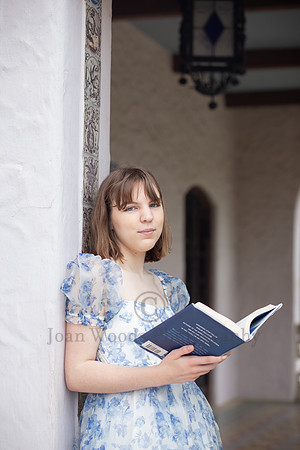 Winston Churchill high Senior portraits at the Mc Nay Art Museum showing off book in hand