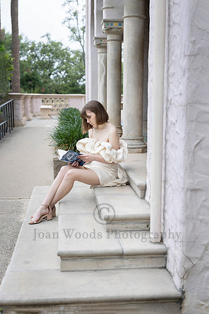 Churchill HS Senior Girl reading books at the MC Nay Art Museum